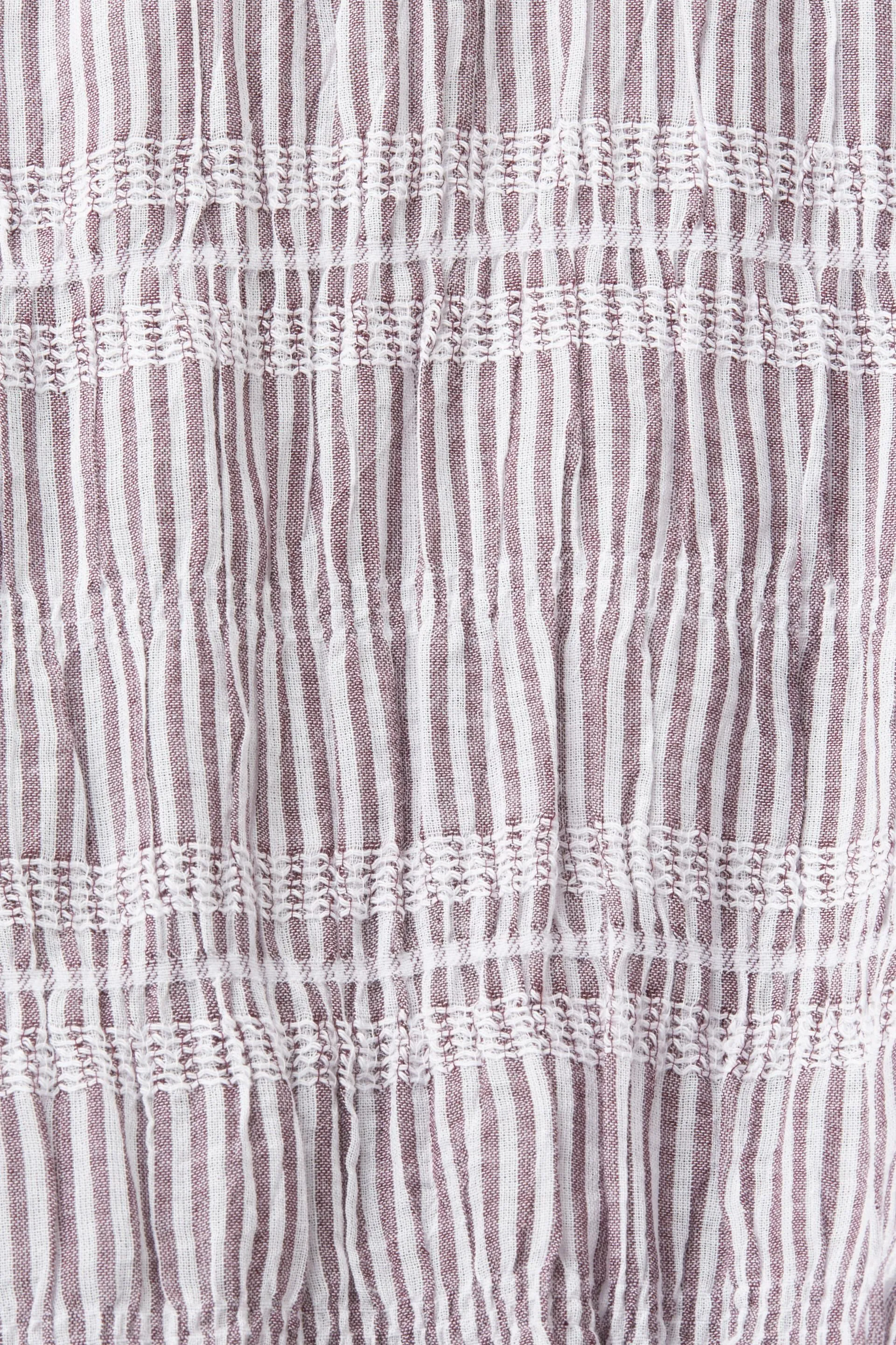 Camisa corta con detalle anudado