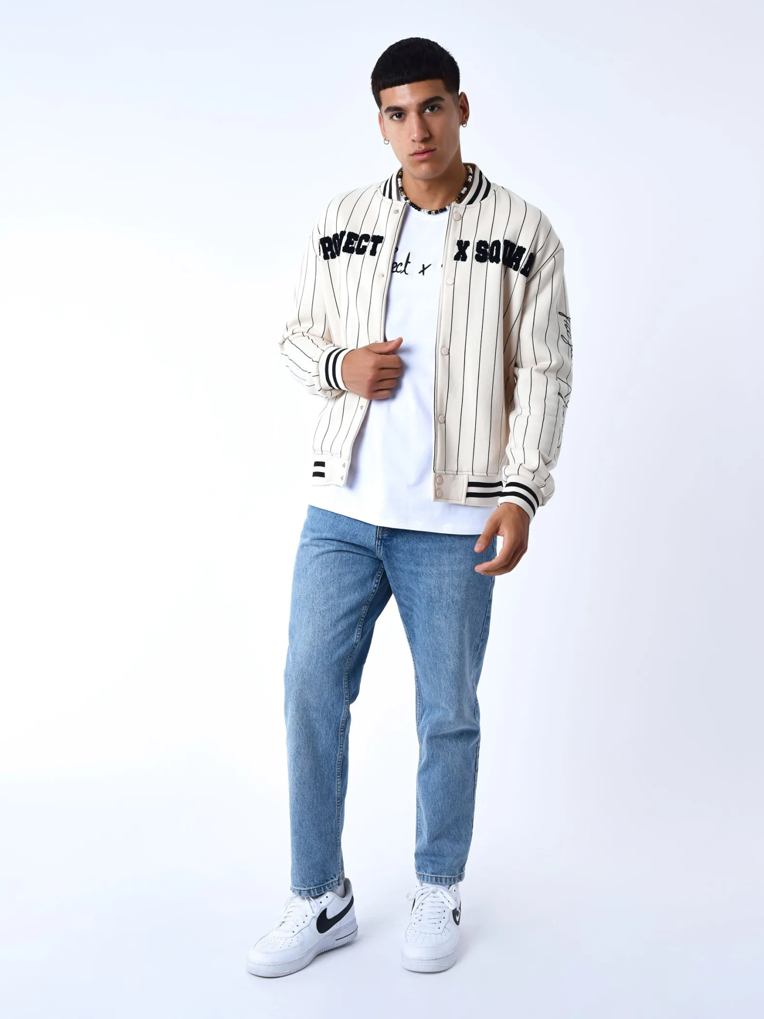 Chaqueta de estilo universitario con rayas